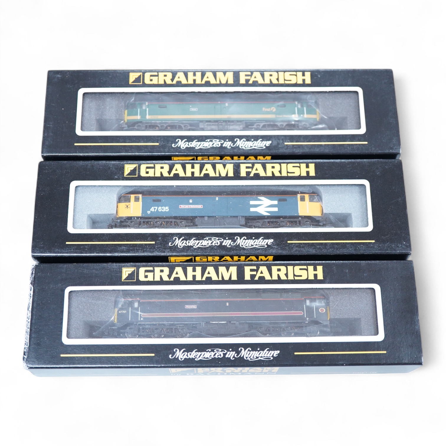 Three boxed Graham Farish N gauge railway Class 47 Co-Co diesel-electric locomotives; a First Great Western, 47832 (371226), a BR 47/4, The Lass O’ Ballochmyle 47635 (371-230), and a Fragonset Railways, Waverley 47701 (3